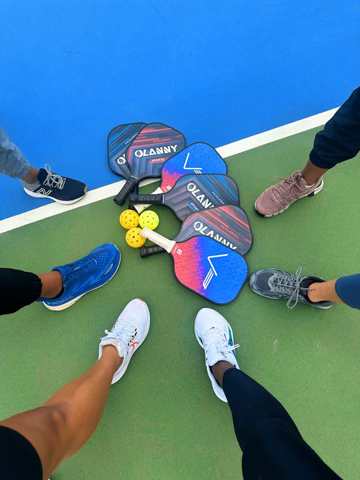 services-02 Group of people preparing for pickleball game on a court in St. George, UT.