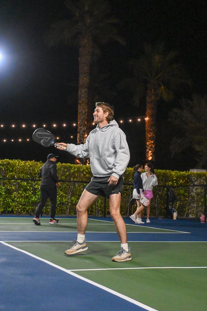 Exciting night pickleball game in Scottsdale featuring players in action on the court.